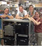 Image of the NOAA AMP instrument team with the AMP sensor